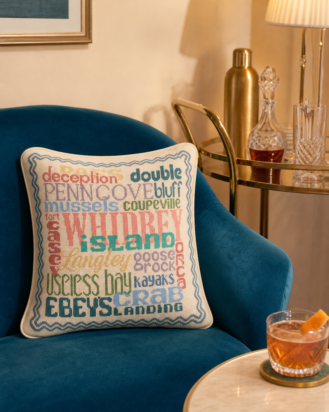 Whidbey Island needlepoint pillow, close-up lifestyle photo of the island-themed word-art design