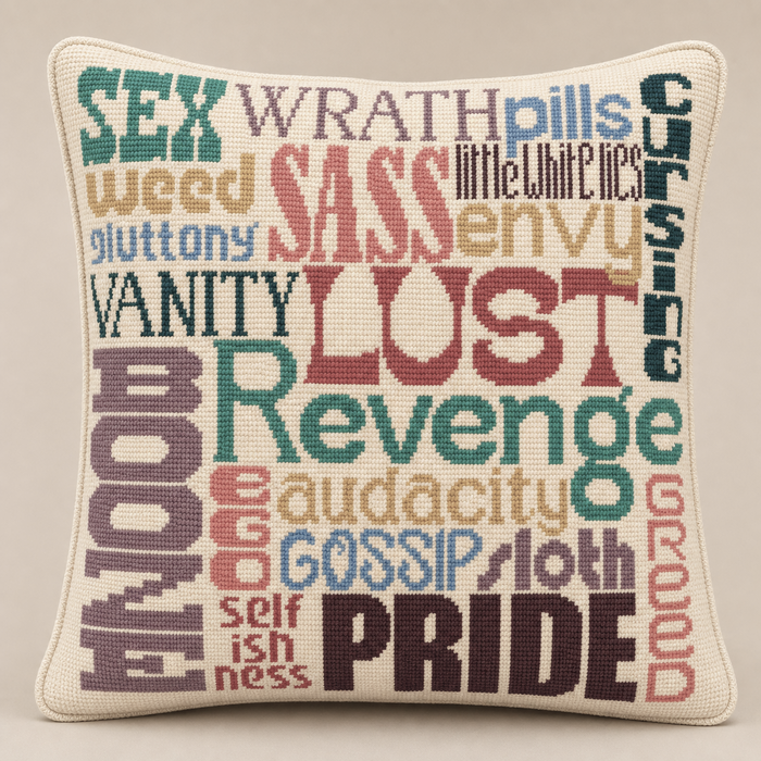 Sins needlepoint pillow kit featuring colorful seven deadly sins word art, studio lifestyle photo