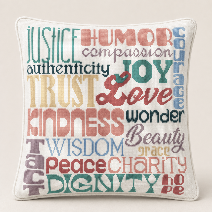 Virtues needlepoint pillow kit featuring colorful virtue word art, studio lifestyle photo