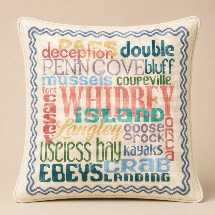 Whidbey Island needlepoint pillow kit featuring colorful island-themed word art, studio lifestyle photo